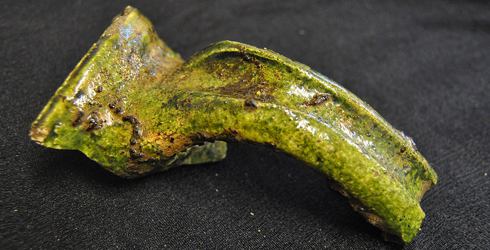 Medieval green glazed pottery jug handle