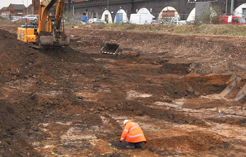 Removing the overburden and preparing the site for excavation