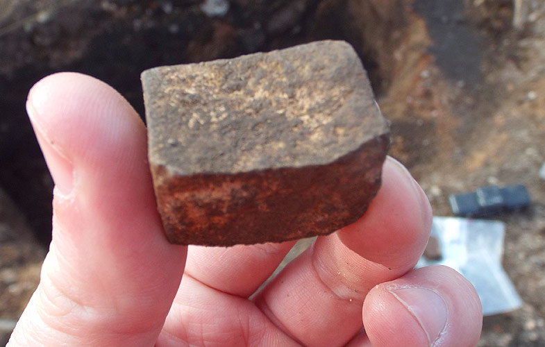 Possible fragment of tessera, an individual tile that could have been used in the creation of a mosaic.