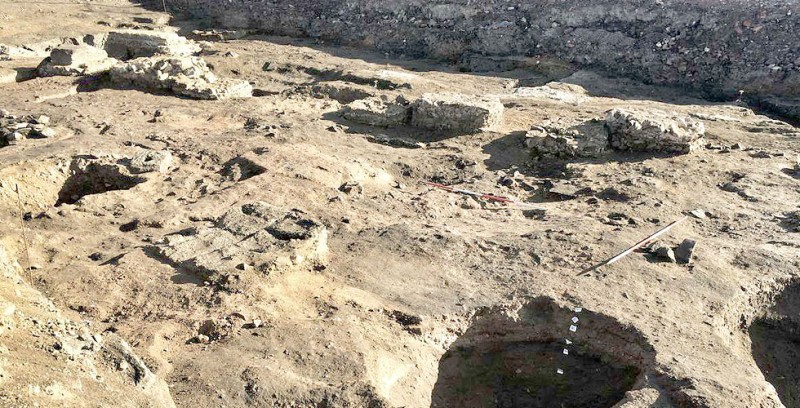 Inside the Roman building with floor layers exposed